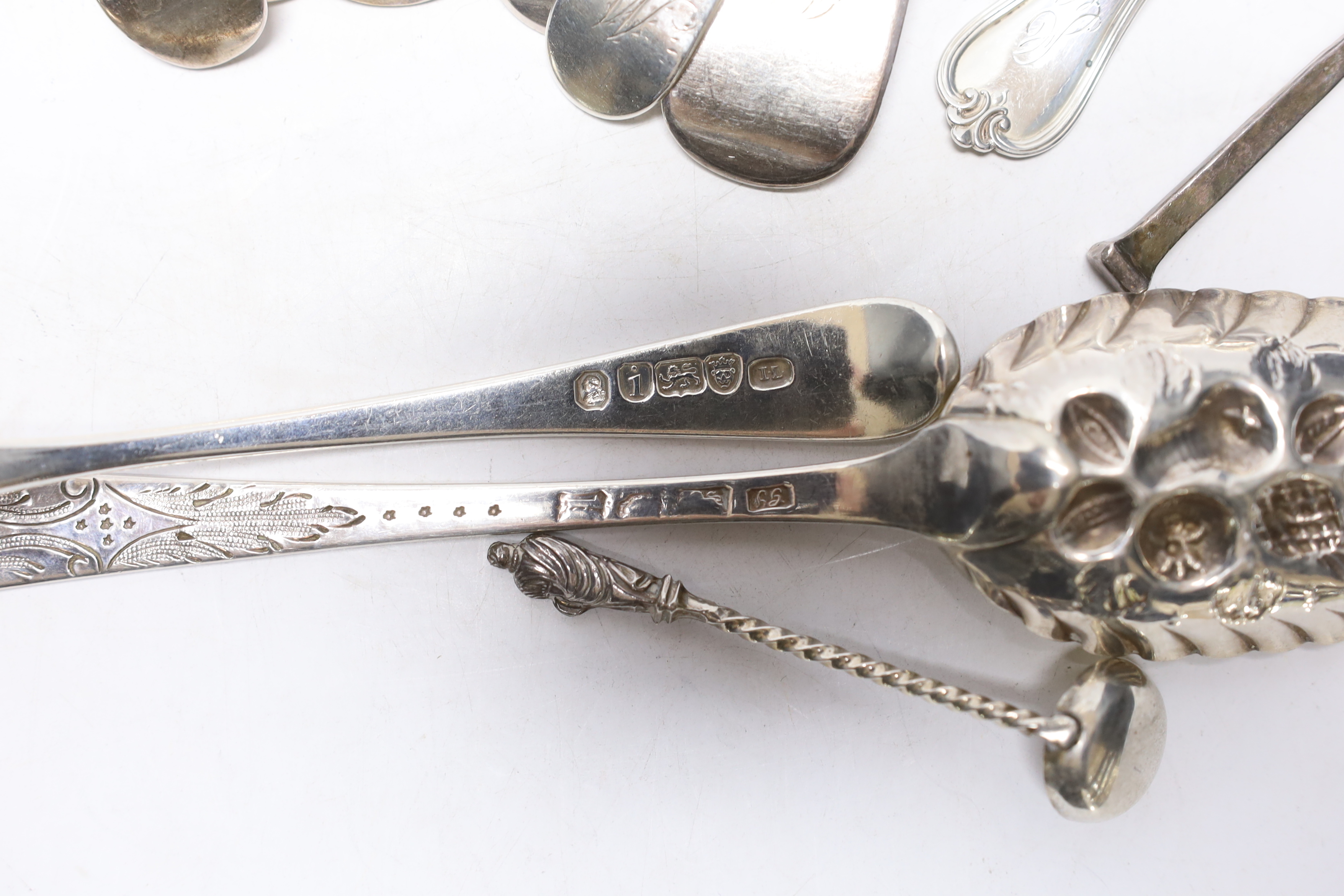 A George III Old English pattern berry spoon, maker George Smith (III), London 1777 and twelve other items of silver or sterling flatware, including a pair of Exeter fiddle pattern tablespoons, 18.3oz.